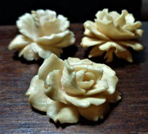 3 celluloid roses